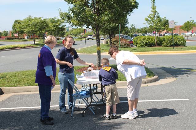 Katies with Kohl's associate talk about poison prevention. Save Your Heart for Love 2012